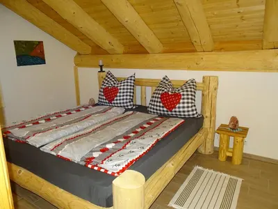 Ein Bett oder Betten in einem Zimmer der Unterkunft C.T.N. Loghouse