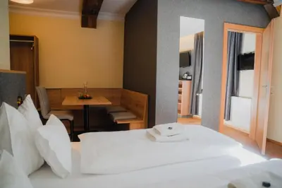Ein Bett oder Betten in einem Zimmer der Unterkunft Hotel Restaurant DAS RÖSSL