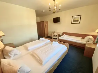 Ein Bett oder Betten in einem Zimmer der Unterkunft Hotel Gasthof Stenitzer