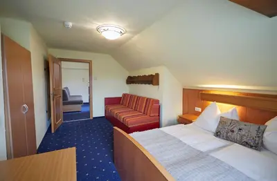Ein Bett oder Betten in einem Zimmer der Unterkunft Hotel Gasthof Stenitzer