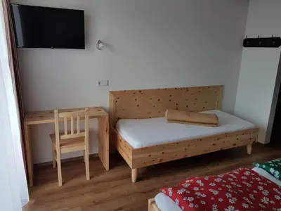 Ein Bett oder Betten in einem Zimmer der Unterkunft Haus Alpenland