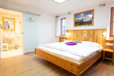 Ein Bett oder Betten in einem Zimmer der Unterkunft Schlicknhof