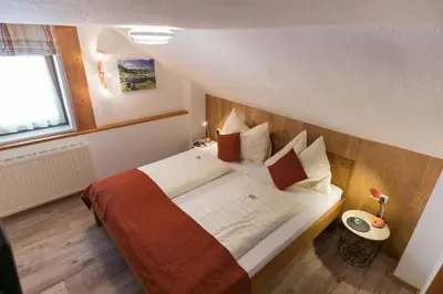 Ein Bett oder Betten in einem Zimmer der Unterkunft Simonegg