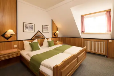 Ein Bett oder Betten in einem Zimmer der Unterkunft Gasthof Murtalerhof