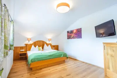 Ein Bett oder Betten in einem Zimmer der Unterkunft Forsterhof
