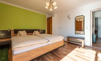 Ein Bett oder Betten in einem Zimmer der Unterkunft Aberseeblick Pension Ellmauer