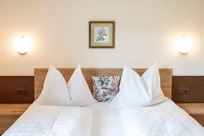 Ein Bett oder Betten in einem Zimmer der Unterkunft Reitsamerhof - Zimmer & Apartments