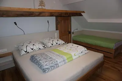 Ein Bett oder Betten in einem Zimmer der Unterkunft Schmiedsipplhof