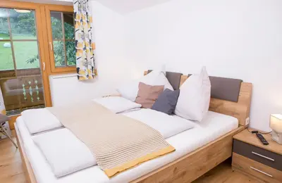 Ein Bett oder Betten in einem Zimmer der Unterkunft Oberschartlhof