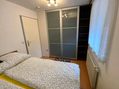 Ein Bett oder Betten in einem Zimmer der Unterkunft Ferienwohnung Holiday