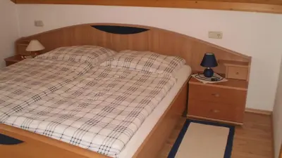 Ein Bett oder Betten in einem Zimmer der Unterkunft Ferienwohnung Schmiedbauer