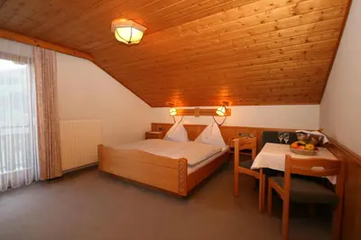 Ein Bett oder Betten in einem Zimmer der Unterkunft Hotel-Café Perner