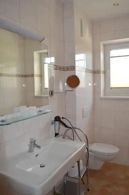 Ein Badezimmer in der Unterkunft Pension Waldheim