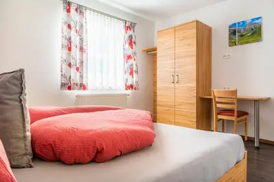 Ein Bett oder Betten in einem Zimmer der Unterkunft Apartment Schlickenhof