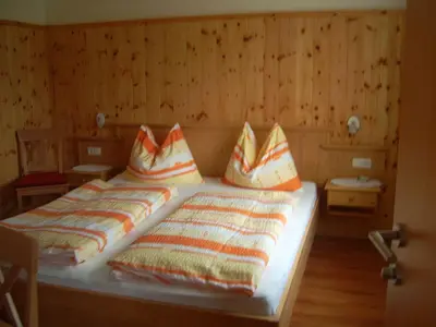 Ein Bett oder Betten in einem Zimmer der Unterkunft Privatpension Gosaukammblick