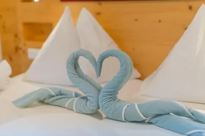 Ein Bett oder Betten in einem Zimmer der Unterkunft Hotel Berghof
