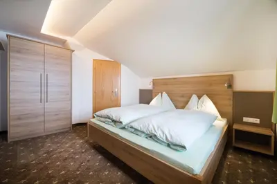 Ein Bett oder Betten in einem Zimmer der Unterkunft Oberegghof