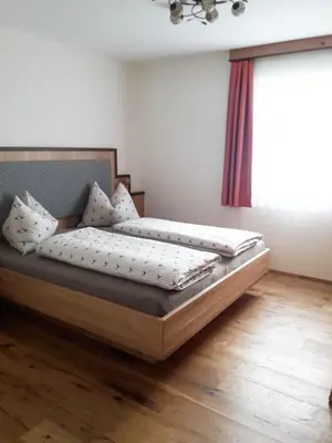 Ein Bett oder Betten in einem Zimmer der Unterkunft Biobauernhof Gast
