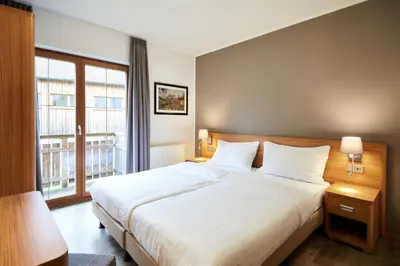 Ein Bett oder Betten in einem Zimmer der Unterkunft Dormio Resort Obertraun