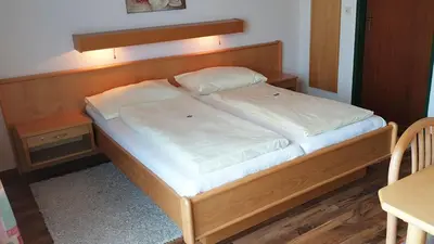 Ein Bett oder Betten in einem Zimmer der Unterkunft Gasthof Strobl Waldfrieden Garni