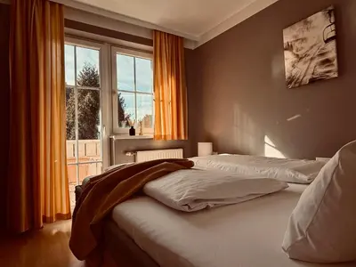 Ein Bett oder Betten in einem Zimmer der Unterkunft Dependance I