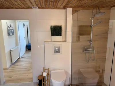 Ein Badezimmer in der Unterkunft White Pearl Apartment