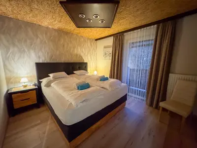 Ein Bett oder Betten in einem Zimmer der Unterkunft White Pearl Apartment