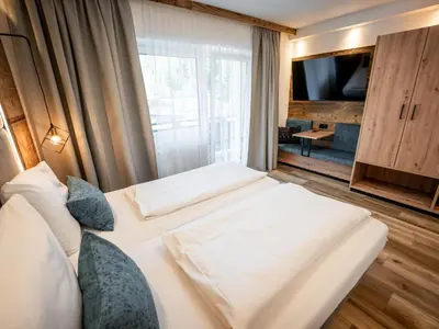 Ein Bett oder Betten in einem Zimmer der Unterkunft Gasthof Gosauschmied