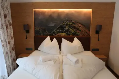 Ein Bett oder Betten in einem Zimmer der Unterkunft Alpenresidenz Hotel Gell