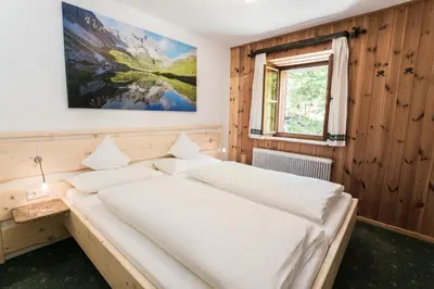 Ein Bett oder Betten in einem Zimmer der Unterkunft Ferienhaus zur Hackenschmiede