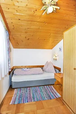 Ein Bett oder Betten in einem Zimmer der Unterkunft Ferienwohnungen Haus Sonnenschein
