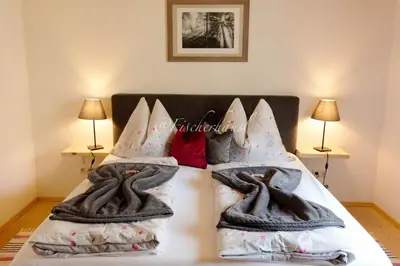 Ein Bett oder Betten in einem Zimmer der Unterkunft Fischerhaus Sankt Wolfgang Appartement 1
