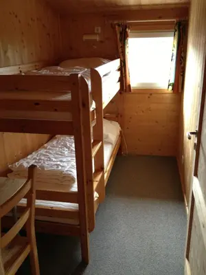 Ein Bett oder Betten in einem Zimmer der Unterkunft Feriendorf Tauerngast