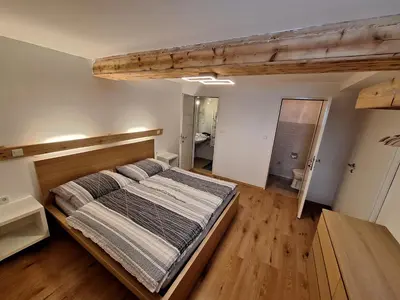 Ein Bett oder Betten in einem Zimmer der Unterkunft Lärchenreith Appartement