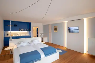 Ein Bett oder Betten in einem Zimmer der Unterkunft Frauscher Hafen-Apartments