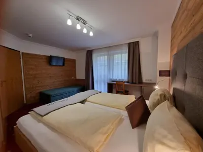 Ein Bett oder Betten in einem Zimmer der Unterkunft Pension Kristall