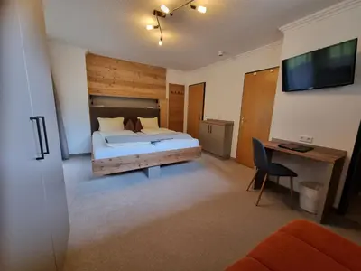 Ein Bett oder Betten in einem Zimmer der Unterkunft Pension Kristall