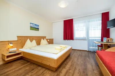 Ein Bett oder Betten in einem Zimmer der Unterkunft Gasthof Jandlalm