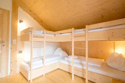 Ein Bett oder Betten in einem Zimmer der Unterkunft Aron Chalet Kreischberg 10A