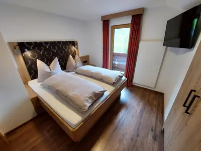 Ein Bett oder Betten in einem Zimmer der Unterkunft Oberauhof Chalet
