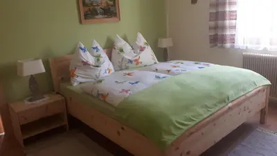 Ein Bett oder Betten in einem Zimmer der Unterkunft Ferienwohnung Greim