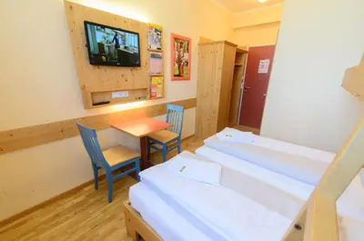 Ein Bett oder Betten in einem Zimmer der Unterkunft JUFA Hotel St Michael im Lungau