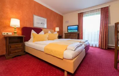 Ein Bett oder Betten in einem Zimmer der Unterkunft Hotel-Pension Das Platzl