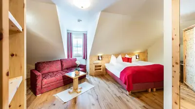 Ein Bett oder Betten in einem Zimmer der Unterkunft Grizzly Sport & Motorrad Resort