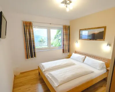 Ein Bett oder Betten in einem Zimmer der Unterkunft Haus Wöhrer / Appartement Fischbacher