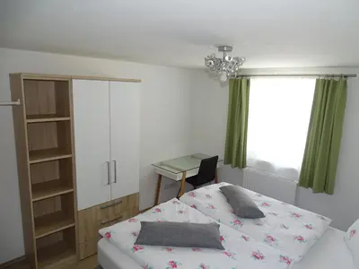 Ein Bett oder Betten in einem Zimmer der Unterkunft Ferienwohnung Stegmühle I