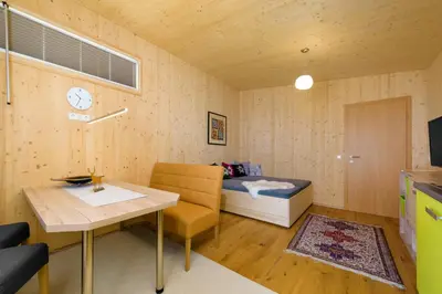 Ein Bett oder Betten in einem Zimmer der Unterkunft Appartement - Vollholz Studio im Zentrum von Flachau