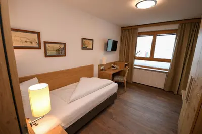 Ein Bett oder Betten in einem Zimmer der Unterkunft Seegasthof Hois'n Wirt - Hotel mit Wellnessbereich
