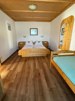 Ein Bett oder Betten in einem Zimmer der Unterkunft Moserhof