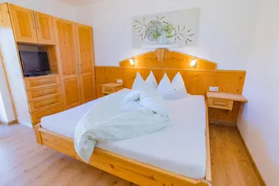 Ein Bett oder Betten in einem Zimmer der Unterkunft Bergerhof